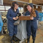Theo and Jeanne, visiting international research students, are looking at a clipboard.